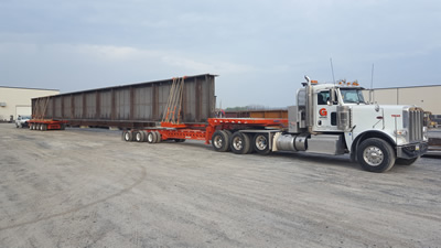 Specialized Trailers Specialized oversize trailer hauling a steel beam